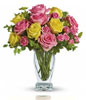 Yellow and light pink roses, pink spray roses and fresh greenery. Approximately 13