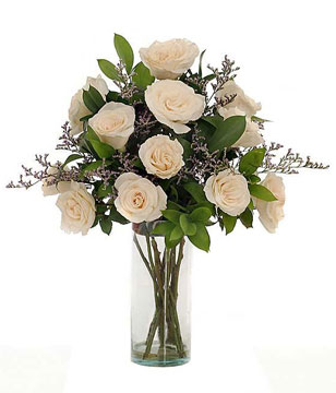 12 white roses in a glass vase 