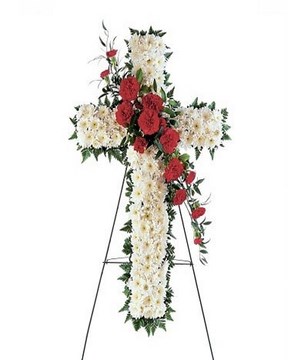 Red and white flowers forming a cross.Easel not included.