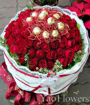 50 red roses and Ferrero Rocher 12 yarn packages . White flowers