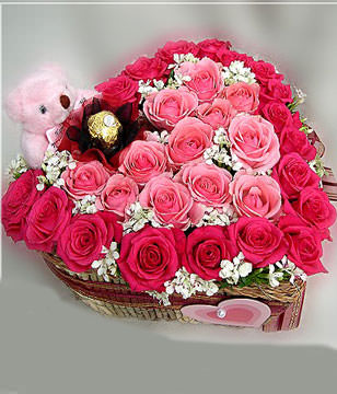 18 roser ladies ,15 pink rosers,a cute bear ,a Ferrero rocher flower and a heart-shape box