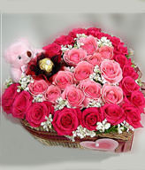 18 roser ladies ,15 pink rosers,a cute bear ，a Ferrero rocher flower and a heart-shape box