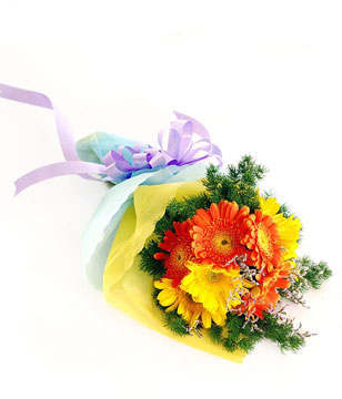 Orange and yellow gerberas with filler in a bouquet 