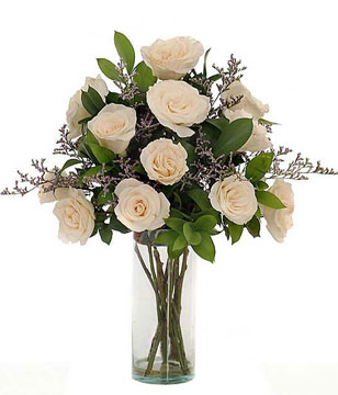 12 white roses in a glass vase