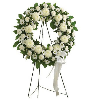 Soothing white flowers such as roses, football mums, carnations and more. Accented by spiral eucalyptus, salal and more