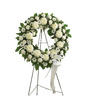 Soothing white flowers such as roses, football mums, carnations and more. Accented by spiral eucalyptus, salal and more