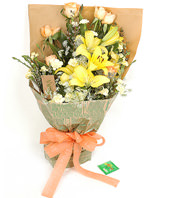  yellow lilies,6 champagne roses and 6 yellow carnations