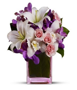 Vase arrangement of lilies and roses