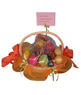 A basket of fruits for the Mid-Autumn Festival, includes red grape, golden pear,apple,one single yolk mooncake an so on. 