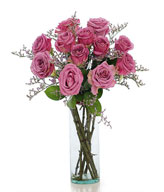 12 Purple roses in a glass vase 