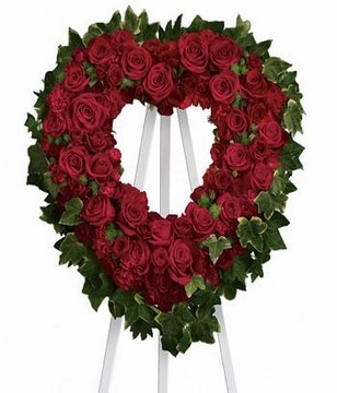 Red roses,spray roses,carnations.23 W x 24 H. Easel not included