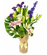 oriental lilies and purple iris so nicely accented with the greens.