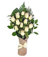 A dozen white roses arrive perfectly arranged