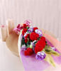 9 red carnations and purple eustomas