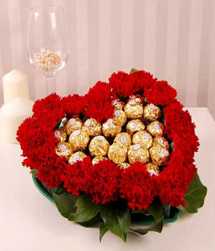 red carnations and Ferrero Rocher Chocolates in Heart Shaped Tray