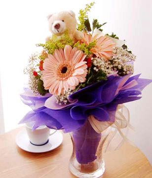 3 pink gerberas and a bear