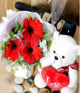 3 red gerberas and 1 bear