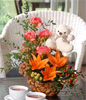 Orange Lilies With Carnations, And Other Flowers In A Basket With White Bear 
