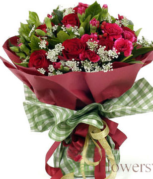19 red roses, a small amount of peach carnations off Lacy and green leaves with