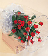 A bouquet of 20 red roses with green foliages