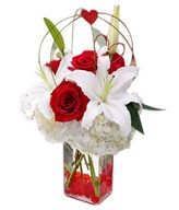 Combination of Roses, Lilies, & Hydrangea In A Vase