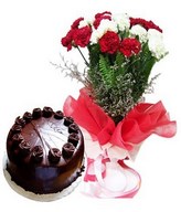 Red and white carnations bouquet and chocolate cake