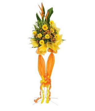 Yellow gerberas & other flowers with stand