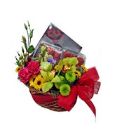 Seasonal fruits with mixed flowers in a basket