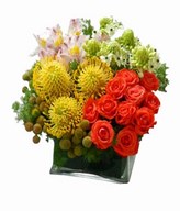 Mixed Seasonal Flowers In A Vase