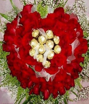 Basket Arrangement of 99 Red Roses with 12 Ferrero Rocher