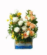 Cream and peach roses with white and Yellow Flower and Hypericum in Glass Vase filled with Blue Gel