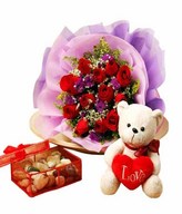 12 red roses with Fillers and a Teddy Bear
