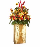 Sunflowers, Red, red Ginger, Lily, Red Gerberas And Orange Carnations On A Box stand