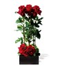 Arrangement of red roses with greenery